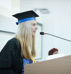 Female graduate delivering speech